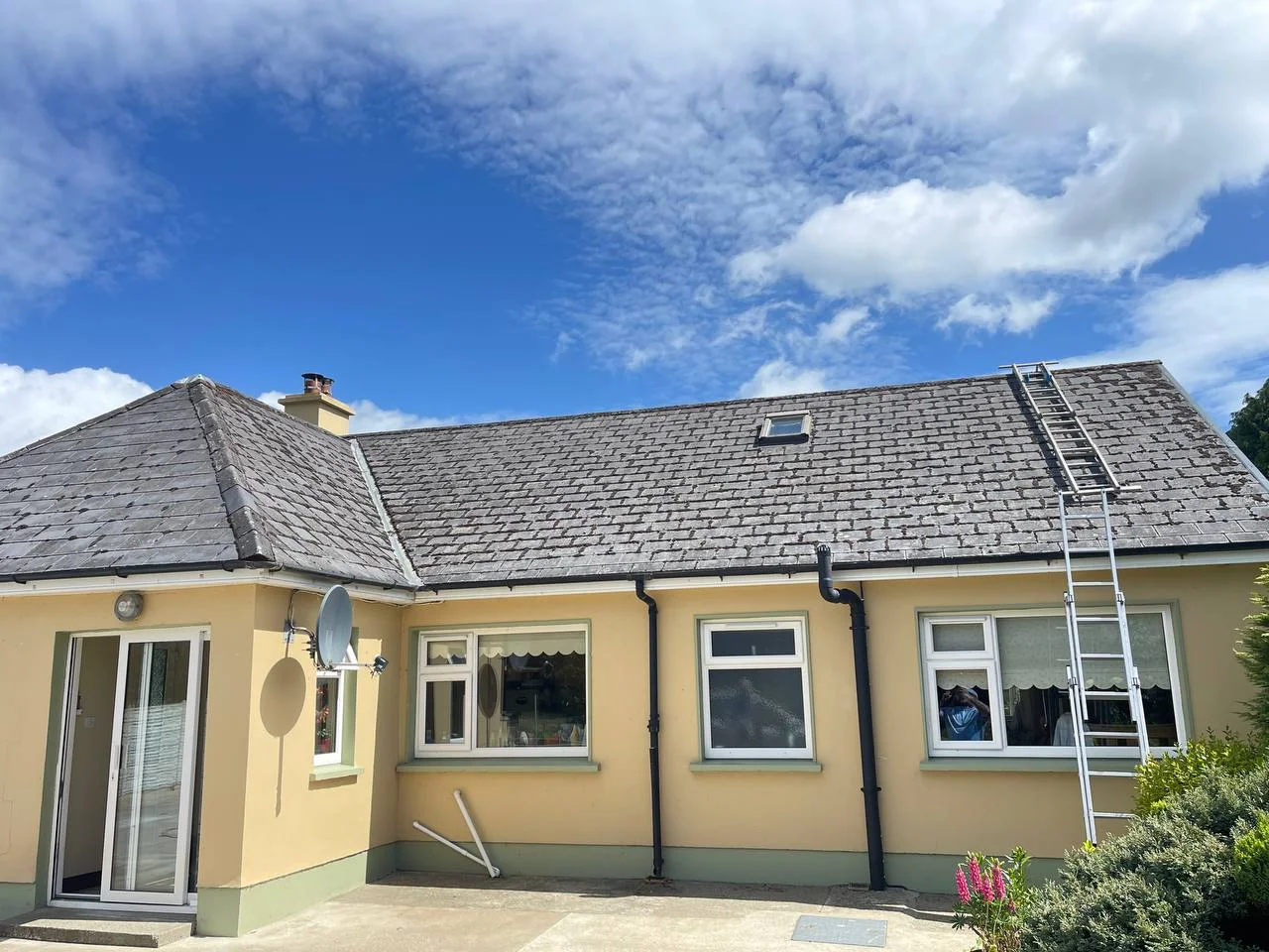 Roof cleaning before moss and algae removal in Kerry